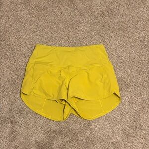 Dark lime yellow lululemon speed up shorts length 4.0